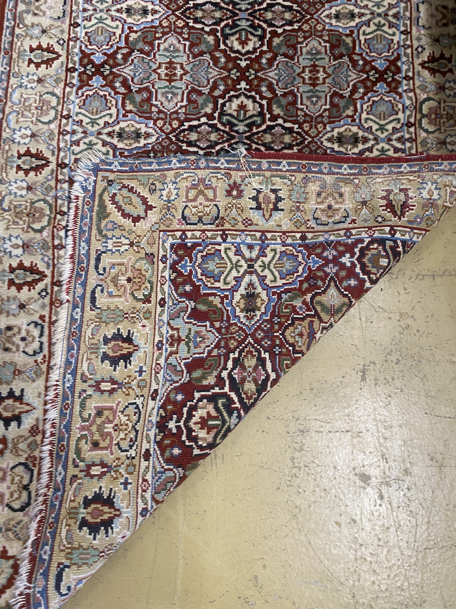 A North West Persian rug and a Bokhara rug, larger 114 x 84cm